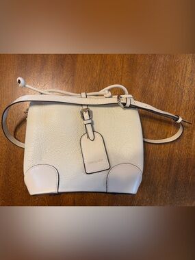 Doris & Jacky Cream Pebbled Leather Crossbody with Buckle Tag